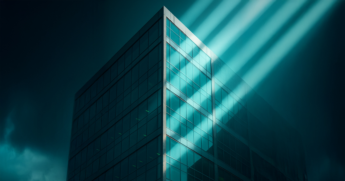 sunlight cutting across a modern glass building, symbolizing resilient business growth strategies during economic uncertainty